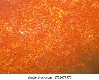 Orange brown background with spiral ripple swirl hot lava flow pattern