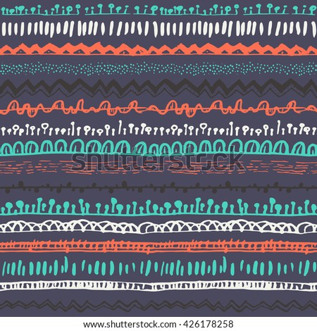 Ornamental ethnic seamless pattern. Endless hand drawn backdrop in boho style, tribal trendy ornament. Horizontal decorative colorful lines on dark background. For cloth, wallpaper, wrapping