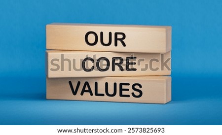 Our core values symbol. Concept words Our core values on wooden blocks.Business and Our core values concept. Copy space.3D rendering on blue background.