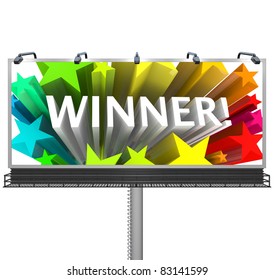 An outdoor billboard announces to the word that the winner has been chosen and congratulates the lucky victor in the competition for the prize or successful candidate