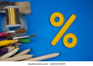 Overhead shot of school supplies with Percentage Sign. Brushes, pencils, artistic tools. Art And Craft Work Tools. - Powered by Shutterstock