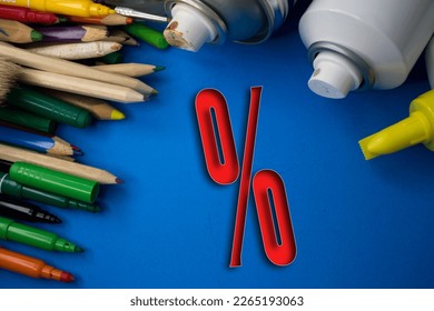 Overhead shot of school supplies with Percentage Sign. Brushes, pencils, artistic tools. Art And Craft Work Tools. - Powered by Shutterstock