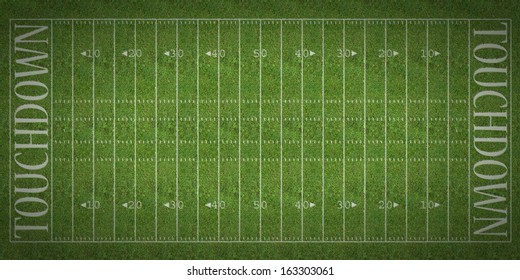 An Overhead View Of An American Football Field With White Markings Painted On Grass.