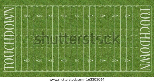 An overhead view of an american\
football field with white markings painted on\
grass.