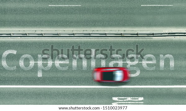 Overhead view of the busy car road with\
Copenhagen text. Travel to Denmark 3D\
rendering