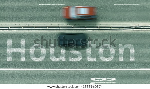 Overhead view of the busy car road\
with Houston text. Travel to the United States 3D\
rendering