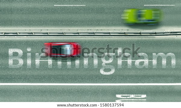 Overhead view of the busy car\
road with Birmingham text. Travel to the United Kingdom 3D\
rendering