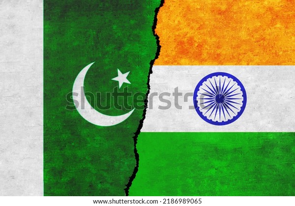 Pakistan and\
India painted flags on a wall with a crack. India and Pakistan\
conflict. Pakistan and India flags\
together