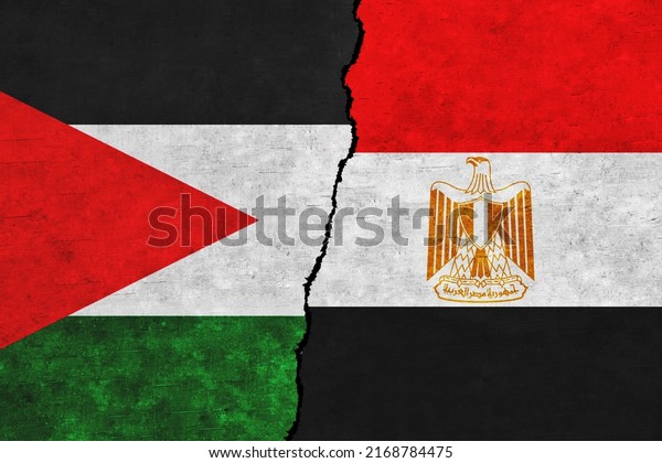 Palestine\
and Egypt painted flags on a wall with a crack. Palestine and Egypt\
relations. Egypt and Palestine flags\
together