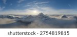 Panoramic 3d Rendering of a snow-covered mountain range at sunrise with mist-filled valleys and distant peaks.