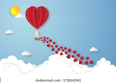  Paper Art , Cut And Digital Craft Style Of The Lover In Hot Air Balloons On Blue Sky And Sunrise Background As Love , Wedding, And Valentine Day Concept.