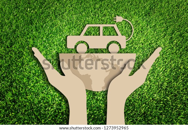 Paper\
art style of eco car concept on green grass background. Electric\
cars. Eco friendly car development. Save the\
earth.