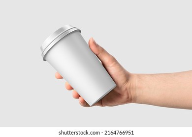 Paper coffee cup in a hand mockup template, isolated on light grey background. High  resolution 3D illustration. - Powered by Shutterstock