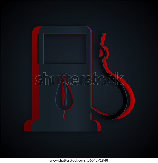 Paper cut Bio fuel concept with fueling nozzle\
and leaf icon isolated on black background. Gas station with\
leaves. Eco refueling. Paper art style.\

