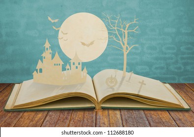 Paper Cut Of Halloween On Old Book