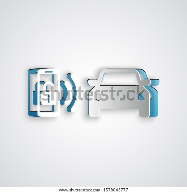 Paper cut Smart car alarm system icon isolated on\
grey background. The smartphone controls the car security on the\
wireless. Paper art style.\
