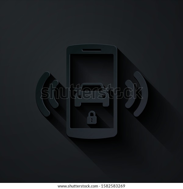 Paper cut Smart car alarm system icon isolated on\
black background. The smartphone controls the car security on the\
wireless. Paper art style.\
