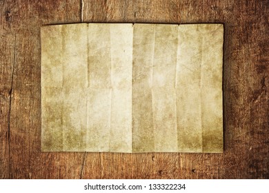 Paper Sheet On Wooden Table