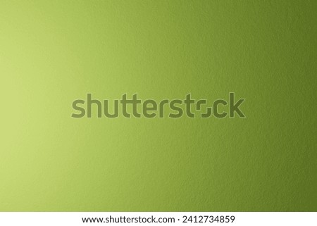 Paper texture, abstract background. The name of the color is tea green. Gradient with light coming from left