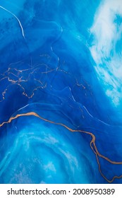 Part Of Original Resin Art, Epoxy Resin Painting. Fluid Art For Modern Banners, Ethereal Graphic Design. Abstract Ethereal Gold, Bronze, Blue And White Swirl. Marble Texture. 