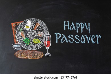 Passover plate and traditional food for Passover (Pesach) on chalkboard. Passover dinner, seder pesach.