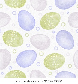 Pastel colored green and very peri blue Easter eggs on a white background. Watercolor seamless pattern. Spring decorative print for fabric, textile design, wrapping paper, greeting cards, wallpaper.