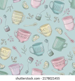 Pattern Of Different Teacups With Herbs, Spoons, Lemons And Tea Bags