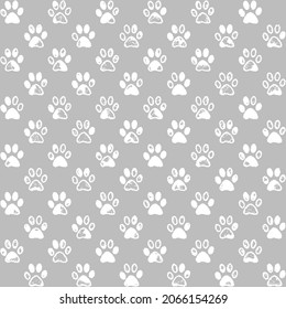 Paw prints in white and gray, a seamless background pattern