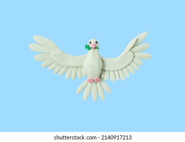 Peace bird made of white plasticine on a blue background. Pray for Ukraine. handmade from plasticine. 3D artwork