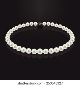 Pearl necklace with reflection on a dark background. With gold claps.