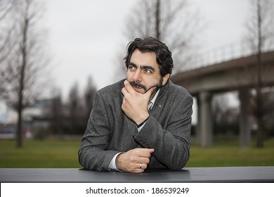 Pensive man at a table