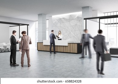 People Near A Wooden And White Reception Counter Of Original Construction Standing In An Office Lobby With A Glass Wall Meeting Room. 3d Rendering