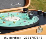 people swim in the pool in the form of a vinyl player 3D render. 3D Illustration