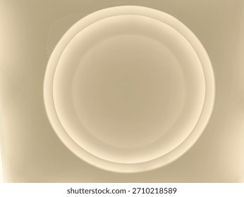 A perfectly circular light structure on the ceiling of a building. The lights shine at night.