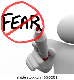 A Person Draws The Word Fear And A Red Circle And Slash Over It With A Red Felt Marker On A Glass Board, Illustrating The Determination To Conquer Fears And Anxieties