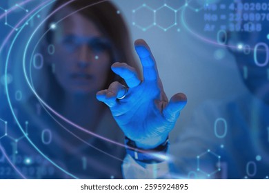 Person interacting with digital interface, blue tones, futuristic technology. Hand gestures, digital data, technology theme. Futuristic digital interface. Business and technology image.