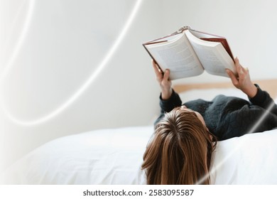 Person reading a book while lying on a bed. Relaxing and enjoying a good book. Cozy reading atmosphere with a focus on literature and leisure. Relaxing and reading image.