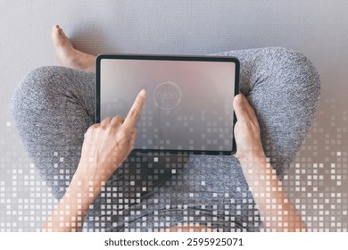 Person using a tablet with a digital interface. Tablet screen shows a timer. Casual setting with a focus on technology and digital interaction. Image with copy space.