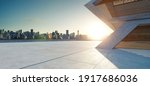 Perspective view of empty concrete floor with cement structure and wooden wall building exterior. 3d rendering. Mixed media.