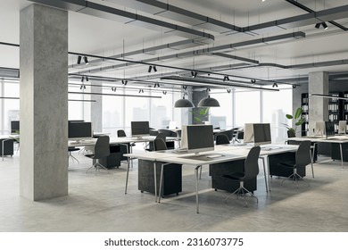 Perspective view of an open loft office interior with desks, computers and concrete floor. A window lets in natural light. Modern workspace design and business background. 3D Rendering