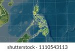 Philippines area map in the Azimuthal Equidistant projection. Topographic map. Full composition of rasters with borders, main cities, capital name and graticule