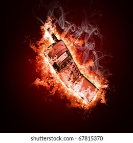 Phone in open fire on a black background