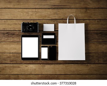 Photo of generic design branding elements on the wood  background.  Horizontal, top view. 3d render