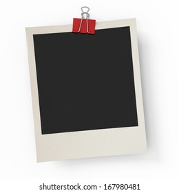 The Photo Hanging On An Office Paper Clip On A White Background