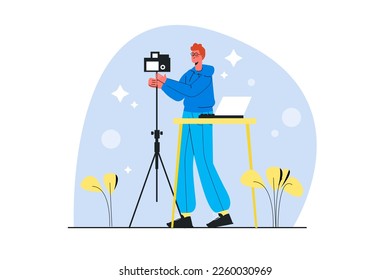 Photo studio blue concept with people scene in the flat cartoon design. Photographer adjusts the camera before the photo shoot. - Powered by Shutterstock