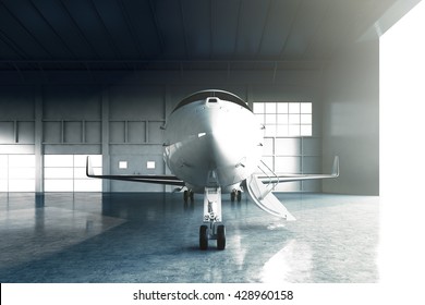 Photo Of White Glossy Luxury Generic Design Private Jet Parking In Hangar Airport. Concrete Floor. Business Travel Picture. Horizontal, Front View. Film Effect. 3D Rendering