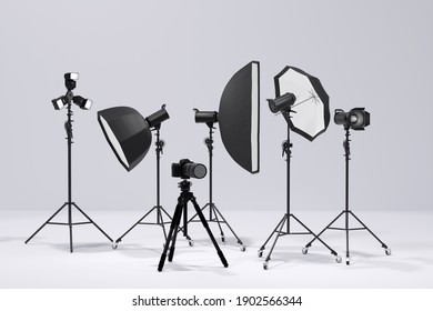 Photography Studio Flash On A Lighting Stand Isolated On White Background With Curtain. 3D Rendering And Illustration Of Professional Equipment Like Monobloc Or Monolight