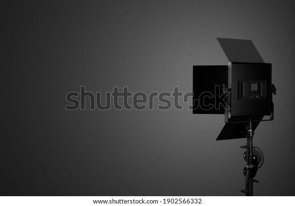 Photography studio led flash light on a stand with\
curtain. 3D rendering and illustration of professional equipment\
like fix professional video\
light