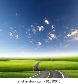 Picture Of Empty Road Leading Toward Horizon And Cloudy Sky