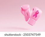 Pink boxing gloves with a breast cancer awareness ribbon on a pink background and copy space for banner design template. Pink October for the fight against breast cancer